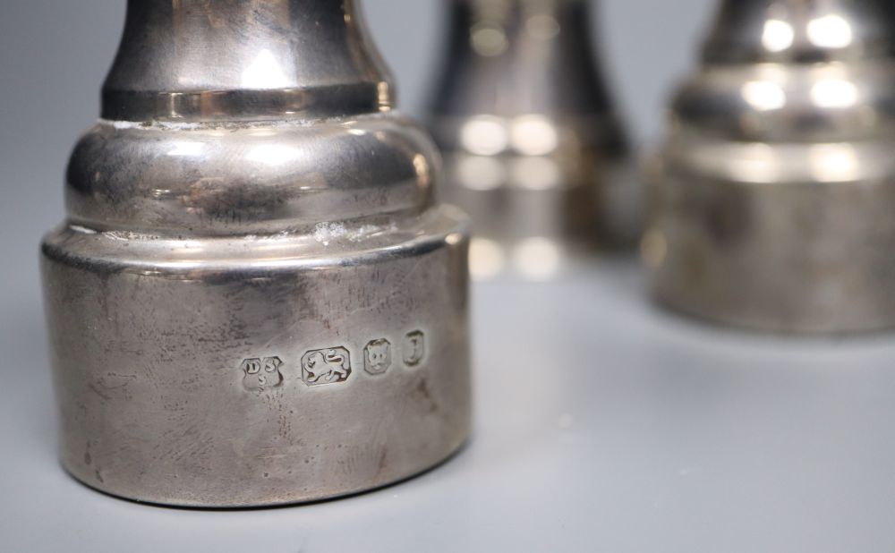 Three assorted modern silver mounted pepper mills, including a pair, London, 1980, tallest 10.5cm.